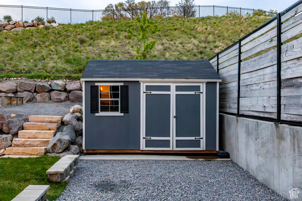 View of shed featuring a fenced backyard