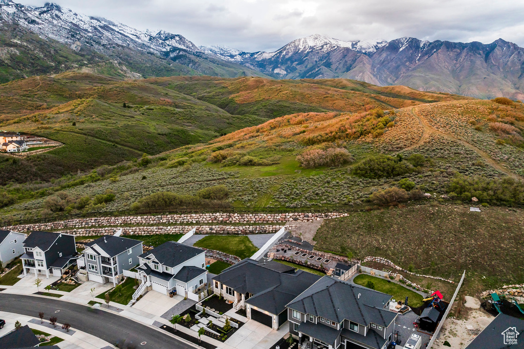 Aerial view of residential area featuring a mountainous background