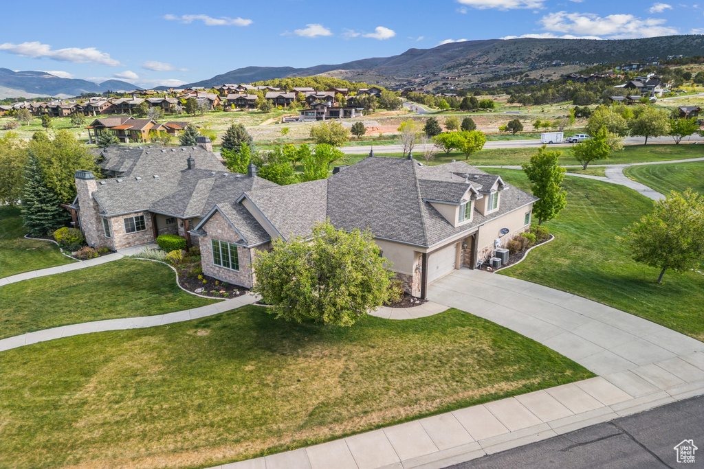 Aerial view of residential area featuring mountains
