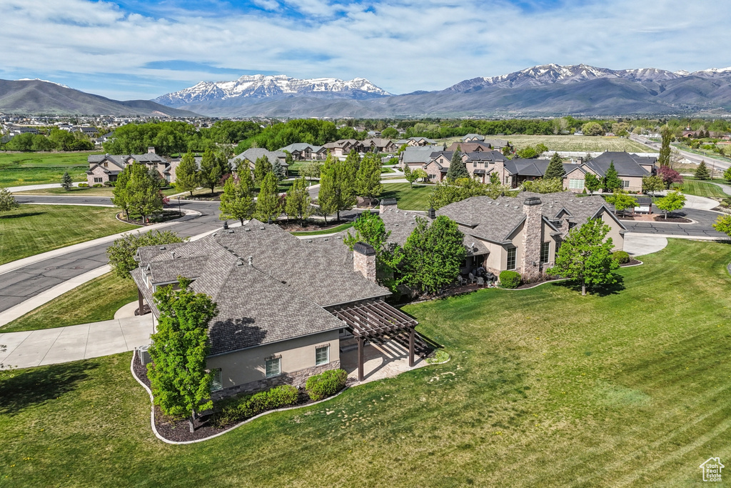 Aerial view of residential area featuring mountains