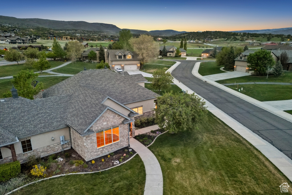 Aerial view at dusk of a mountain view and a residential view