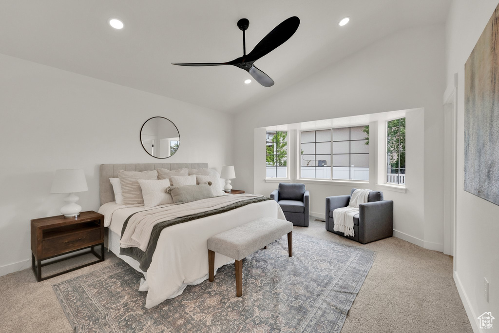 Carpeted bedroom featuring lofted ceiling, recessed lighting, baseboards, and a ceiling fan