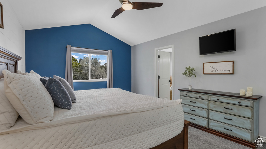 Bedroom with carpet, lofted ceiling, and a ceiling fan