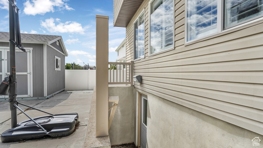 View of patio with fence