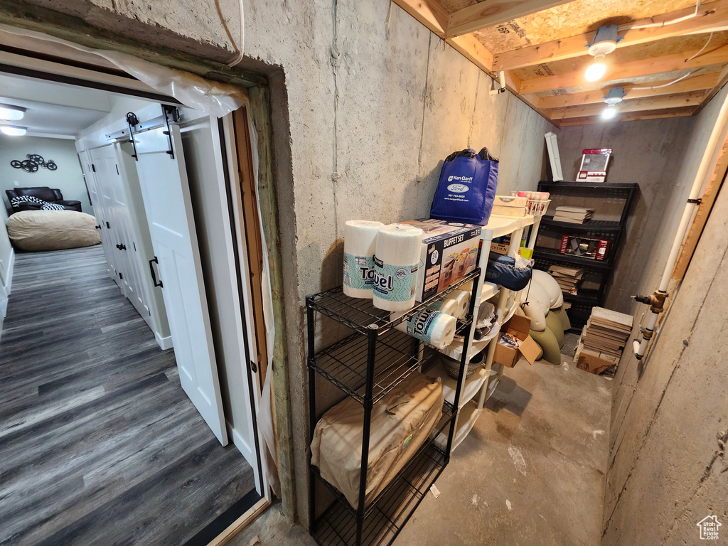 Basement featuring a barn door