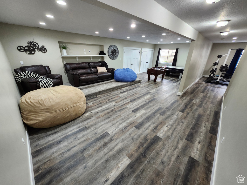 Workout room featuring billiards, recessed lighting, dark wood-style flooring, baseboards, and a textured ceiling
