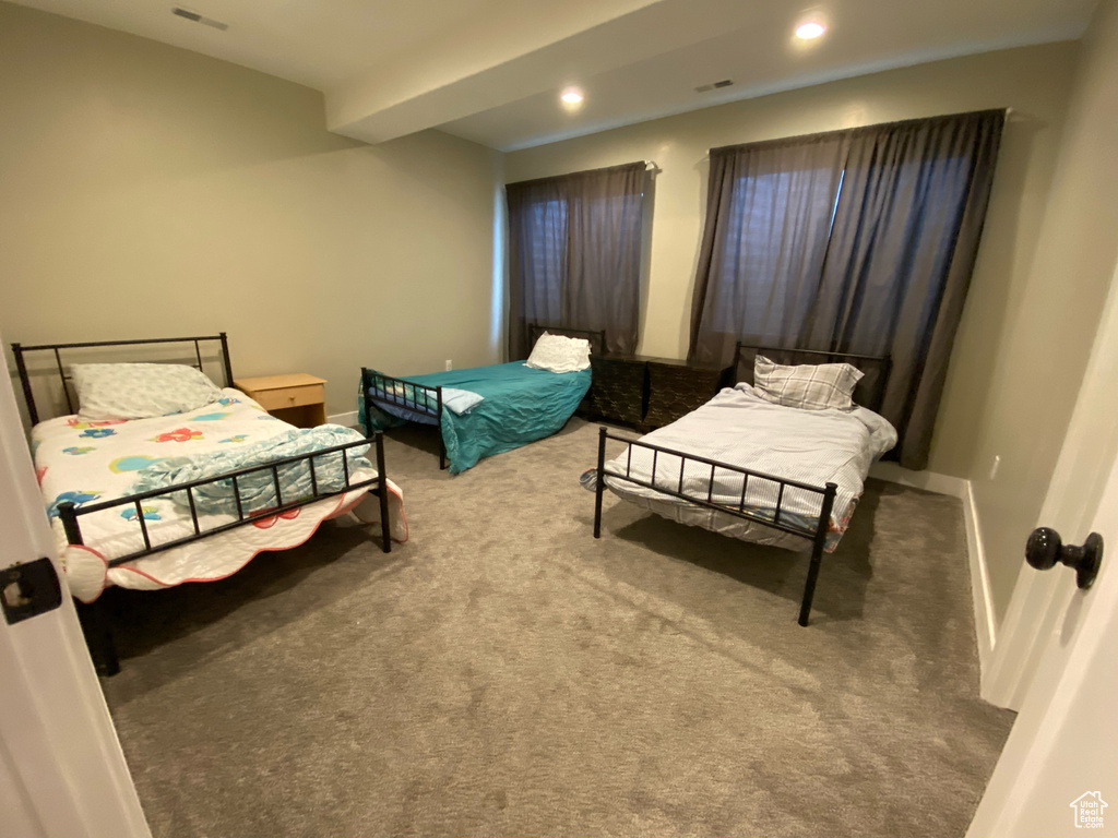 Carpeted bedroom featuring baseboards and recessed lighting