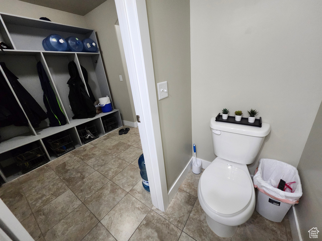 Bathroom with toilet and baseboards