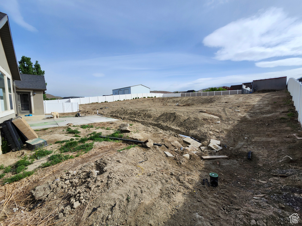 View of yard featuring fence