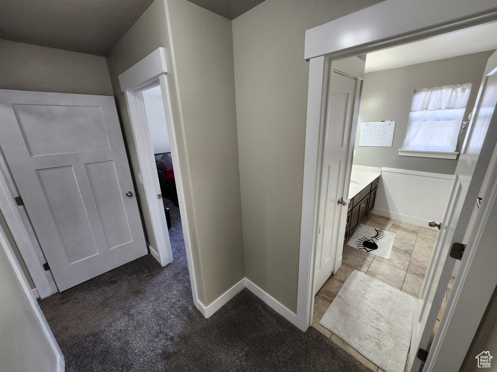 Bathroom with vanity and baseboards