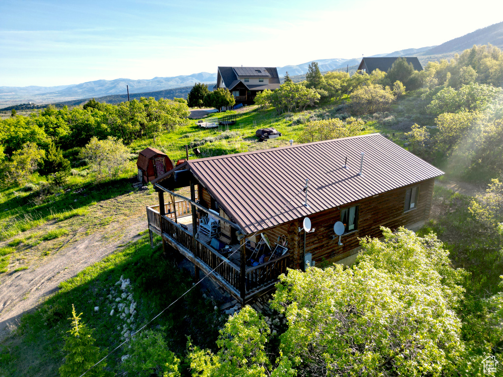 View of subject property with a mountain backdrop