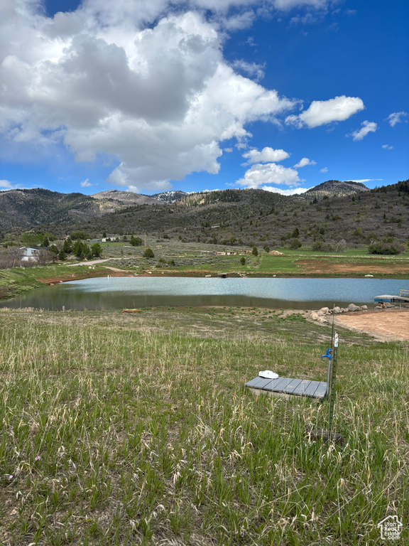 View of mountain backdrop with a large body of water