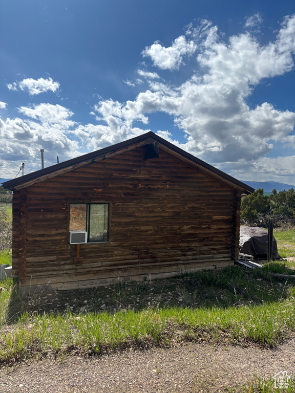 View of side of property featuring log exterior