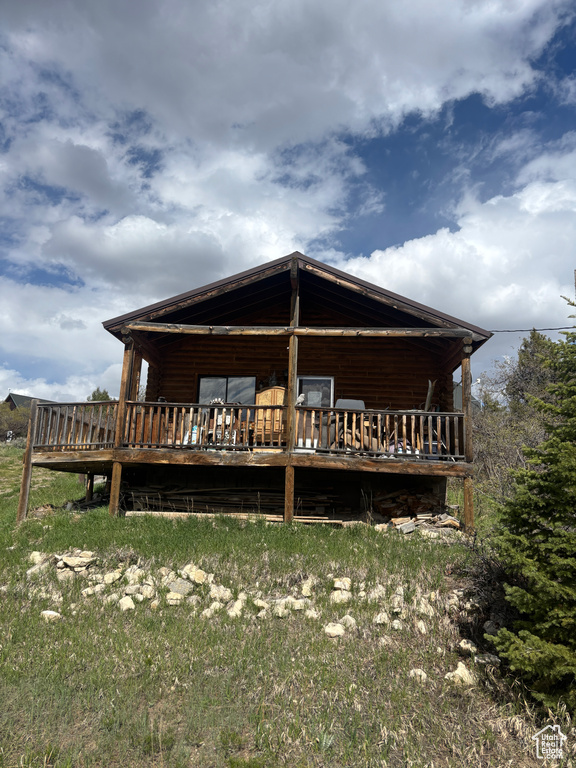 Back of property with a deck