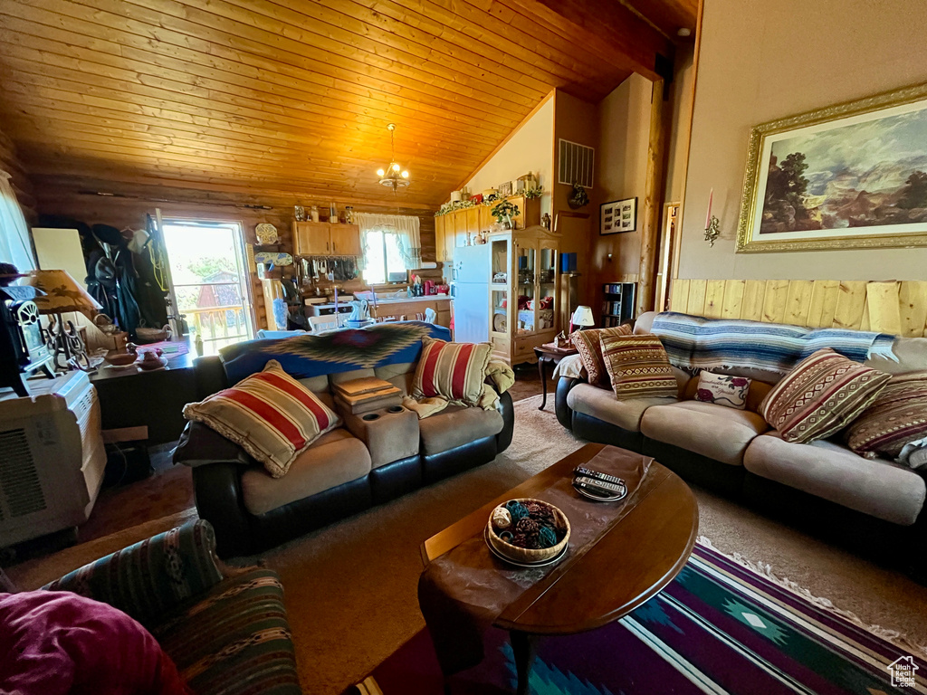 Living room featuring wooden ceiling, vaulted ceiling, wooden walls, and a wainscoted wall