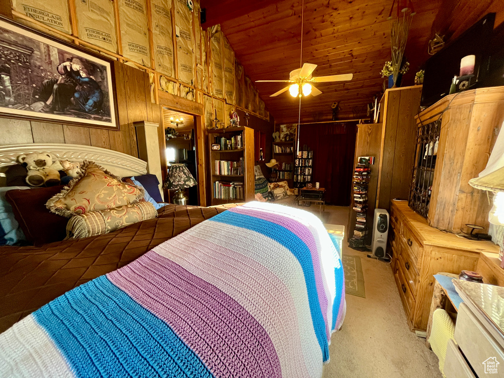Bedroom featuring wood walls, wood ceiling, carpet, and high vaulted ceiling