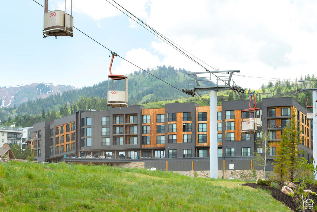 View of property with a mountain view