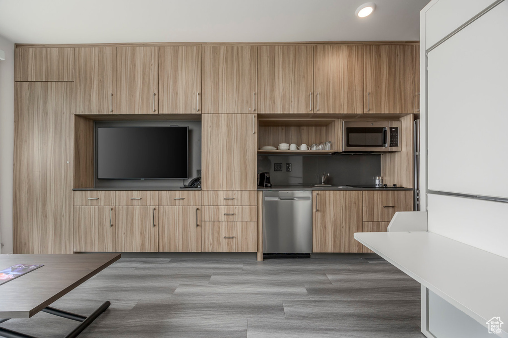 Kitchen featuring stainless steel appliances, light brown cabinets, open shelves, recessed lighting, and modern cabinets