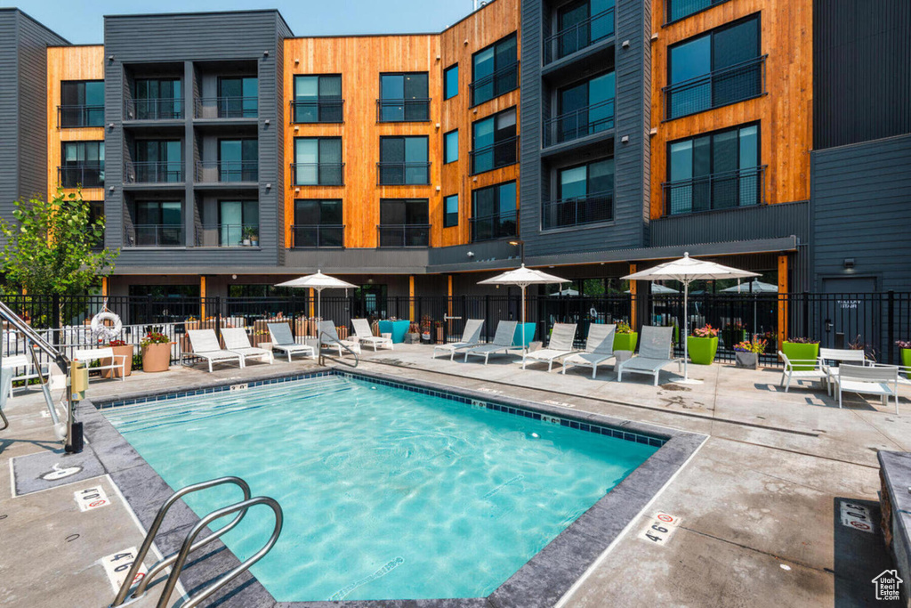 Community pool featuring a patio