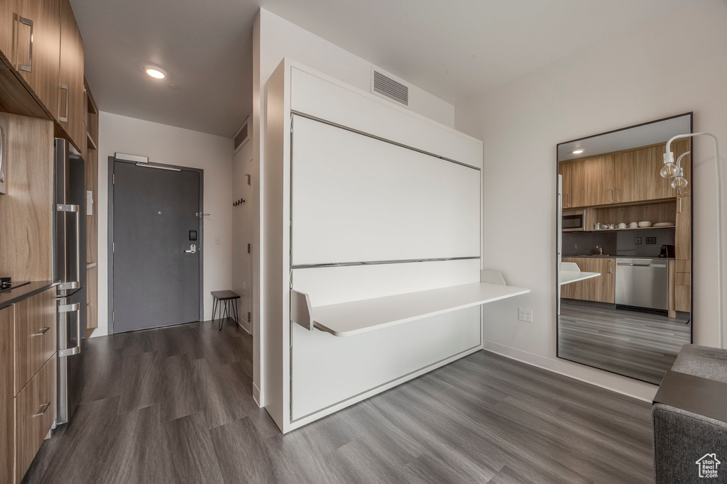 Bathroom with wood finished floors and recessed lighting