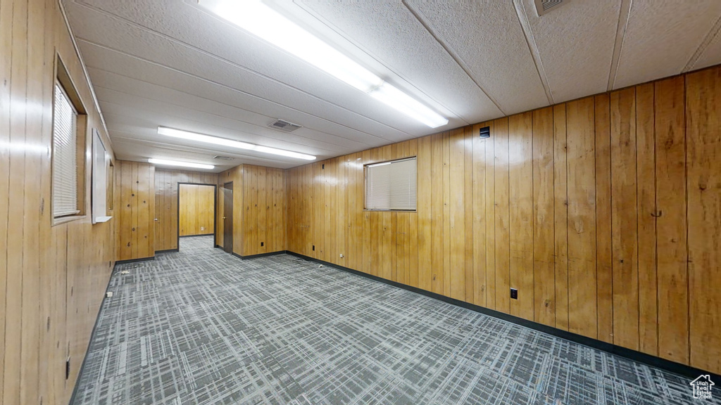 Finished below grade area with wood walls and baseboards