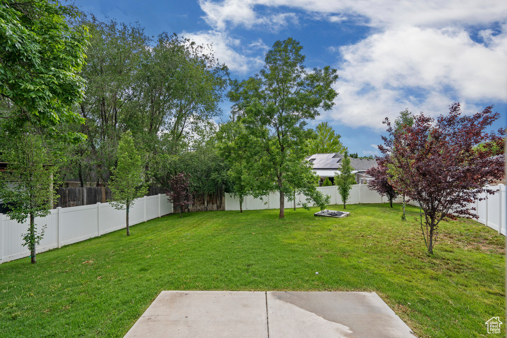 View of yard with a patio