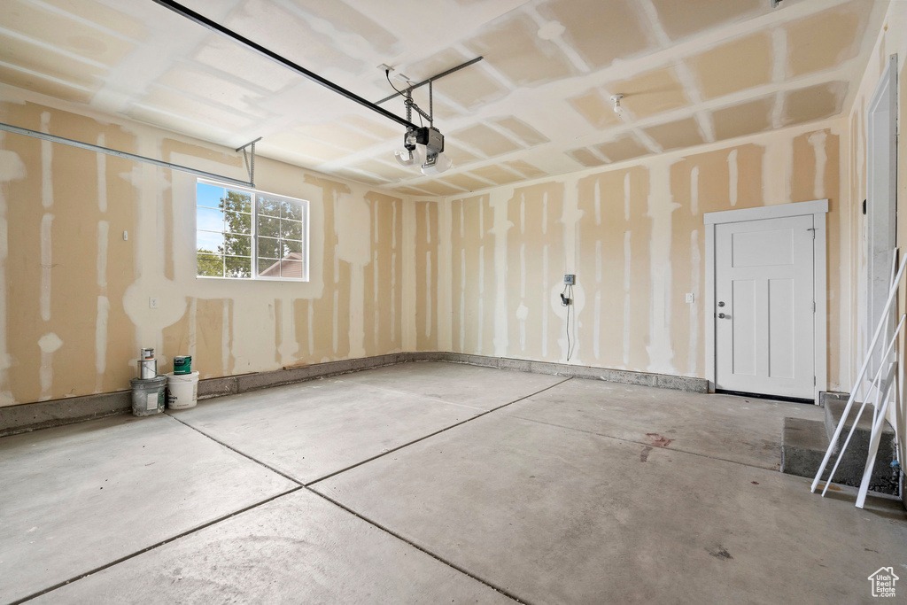 Garage featuring a garage door opener