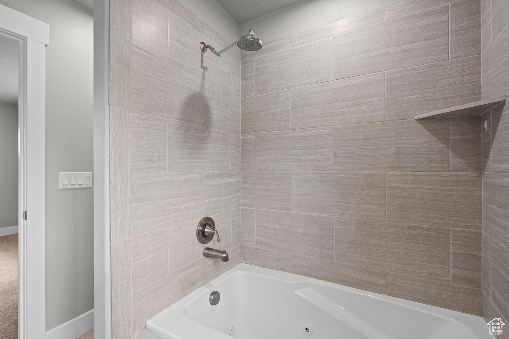 Full bathroom with a combined bath / shower with jetted tub