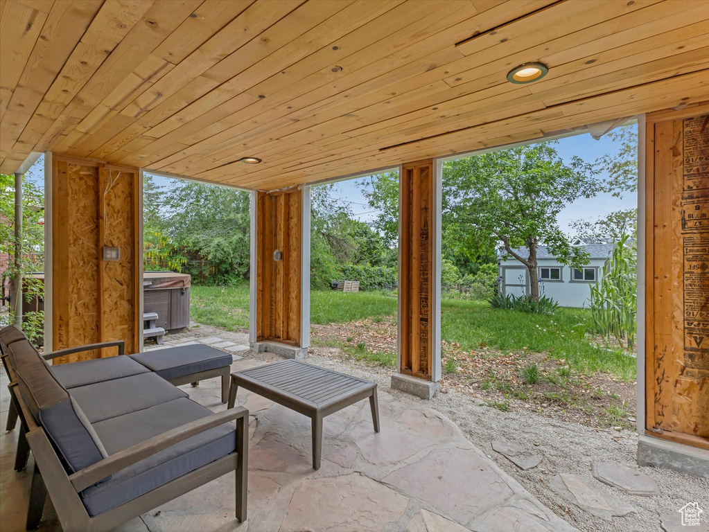 View of patio / terrace with a hot tub