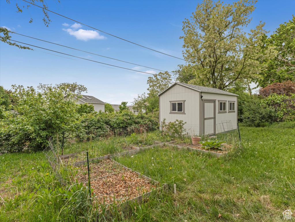 View of shed with a garden