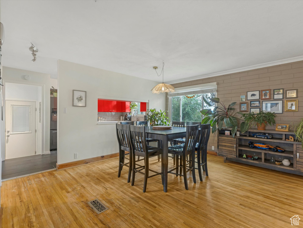 Dining area with wood finished floors and baseboards