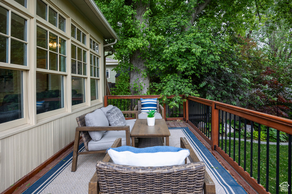 Wooden terrace featuring an outdoor hangout area