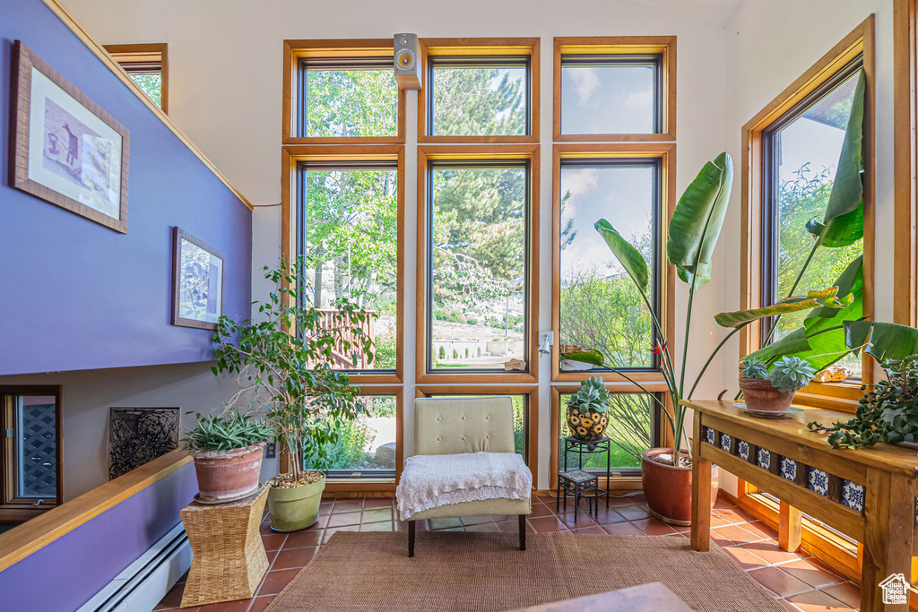 Sunroom featuring baseboard heating