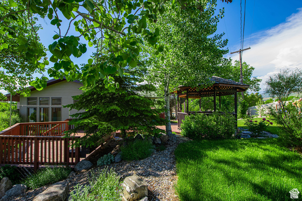 View of yard featuring a gazebo and a deck