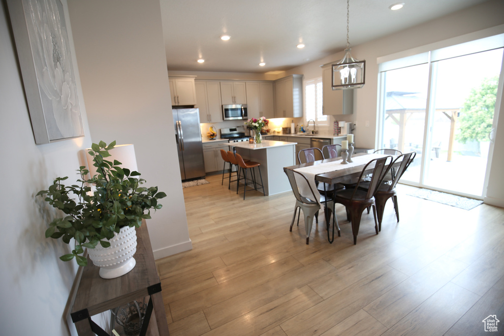 Dining space featuring recessed lighting and light wood finished floors