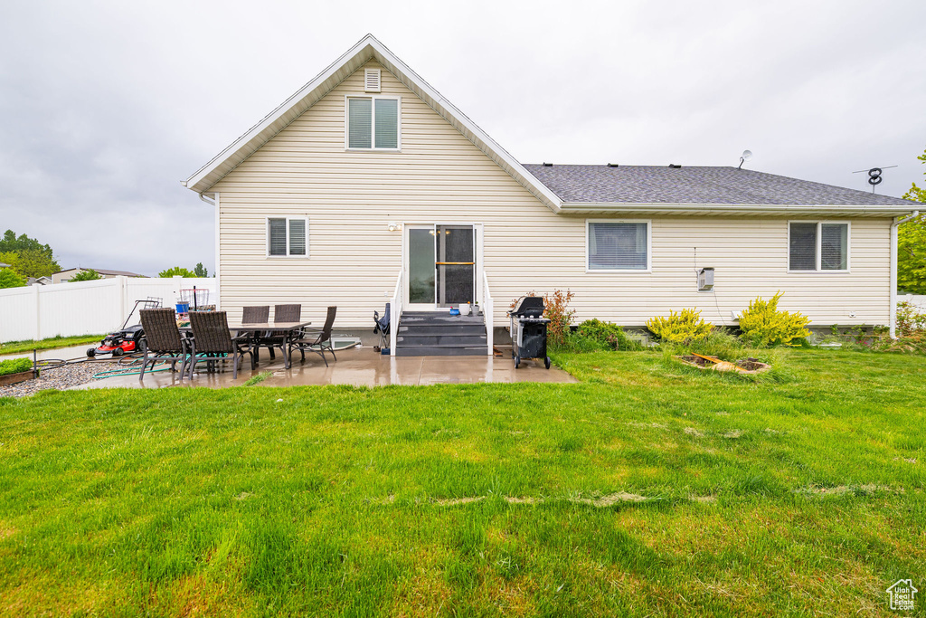 Rear view of house with a patio