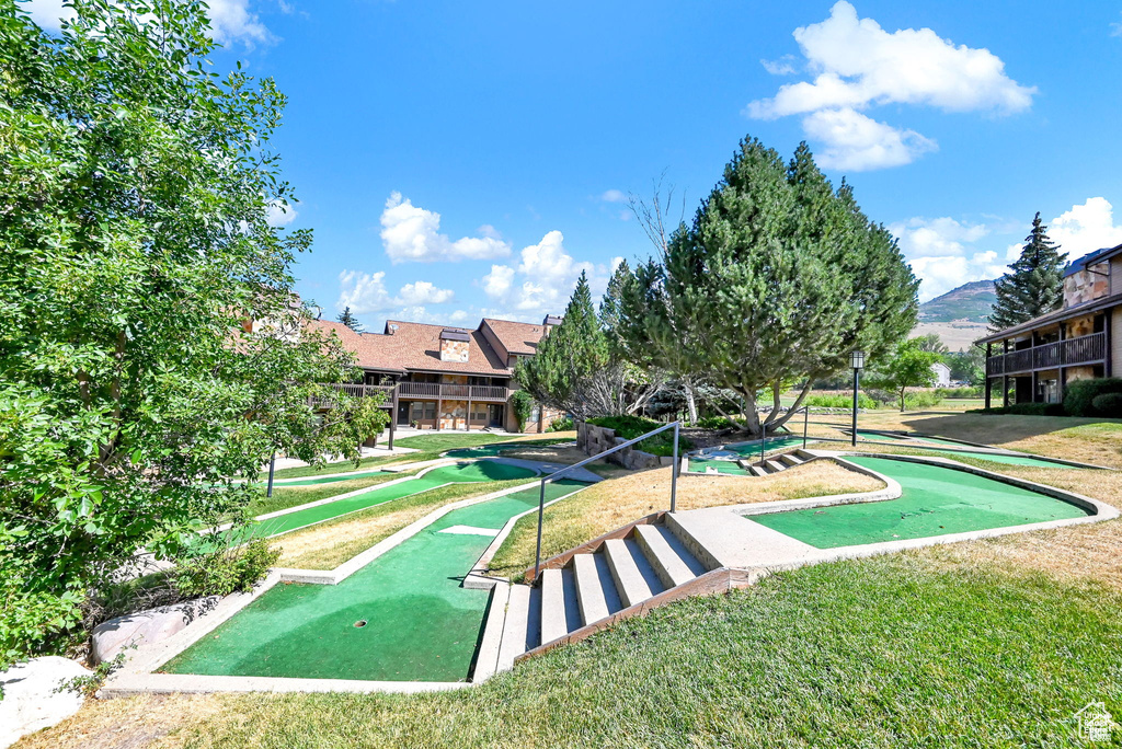 View of community featuring a putting area and a mountain view