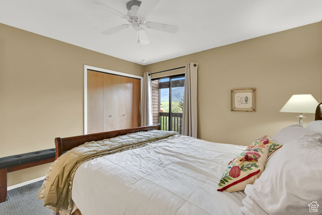 Bedroom featuring carpet flooring, a closet, ceiling fan, and baseboards