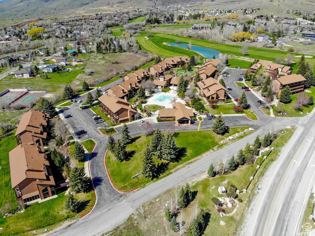 Aerial perspective of suburban area featuring a large body of water