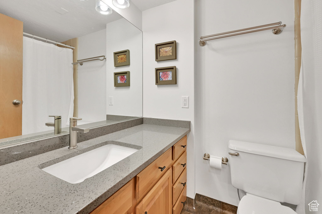 Bathroom featuring toilet and vanity