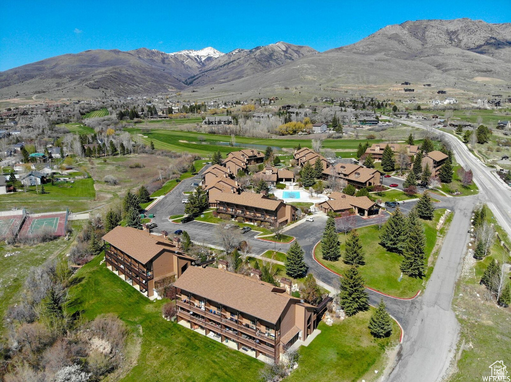 Aerial overview of property's location with a mountainous background