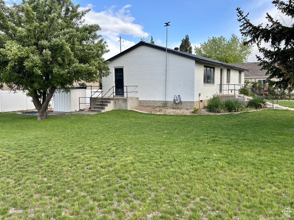 View of property exterior with an outbuilding