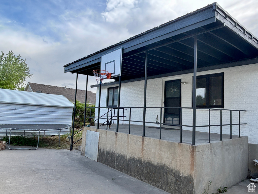 View of home\\\'s exterior featuring covered porch and brick siding