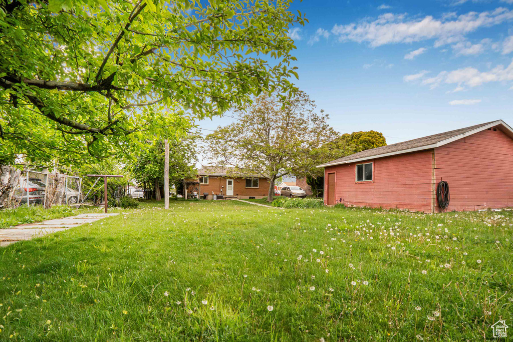 View of yard featuring fence