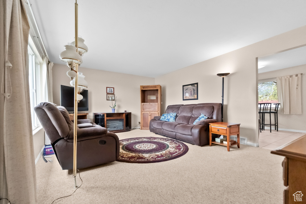 Living room featuring carpet flooring and baseboards