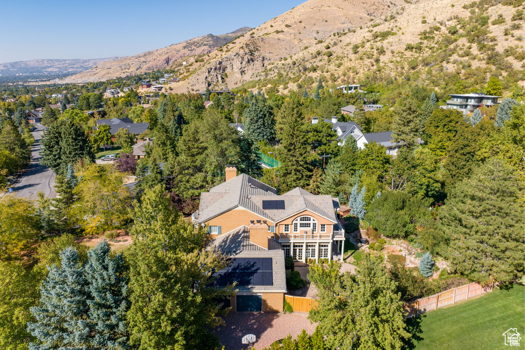 View from above of property with a mountain backdrop
