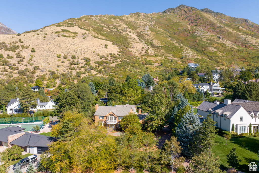 Aerial perspective of suburban area featuring a mountainous background