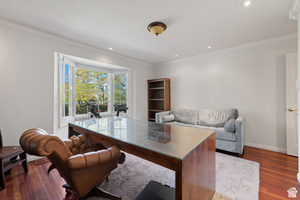 Office with ornamental molding, wood finished floors, baseboards, and recessed lighting