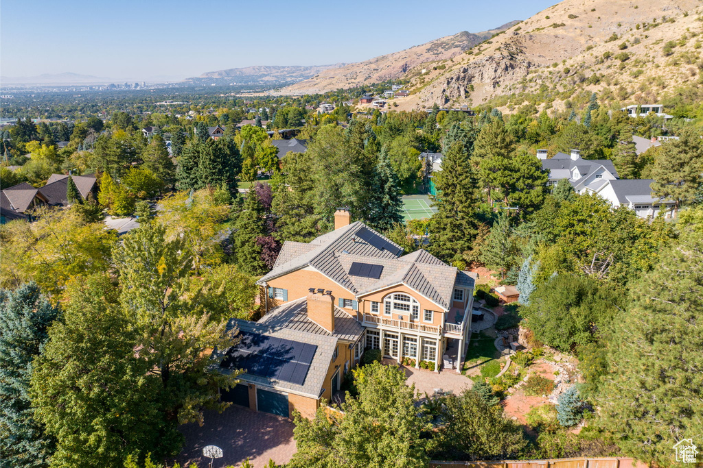 View of subject property with a mountain backdrop