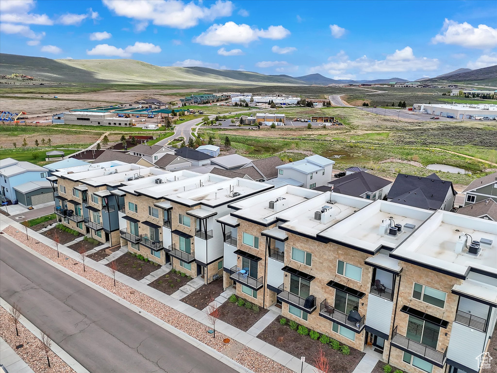 Aerial perspective of suburban area featuring a mountain backdrop